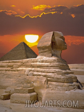 sphinx and pyramid at sunset