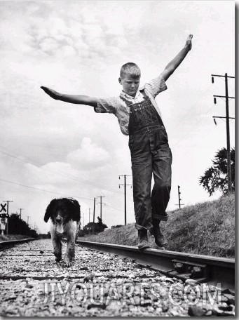 Larry Jim Holm, 12, with Dunk, His Spaniel Collie Mix, Walking Rail of Railroad Tracks in Rural Are