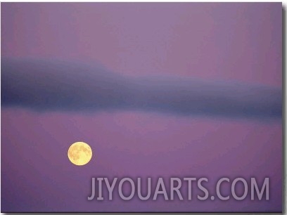 A Twilight View of the Full Moon over the Canadian Arctic