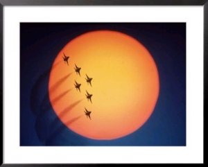 Jet air show in front of setting sun
