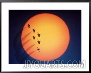 Jet air show in front of setting sun