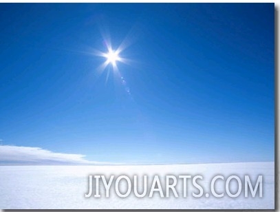 The Sun Appears as a Bright Pointed Star in a Crisp Blue Polar Sky