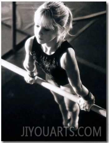 Girl Performing Gymnastics on Uneven Parallel Bars