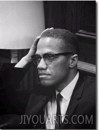 Malcolm X waits at Martin Luther King Press Conference, 1964
