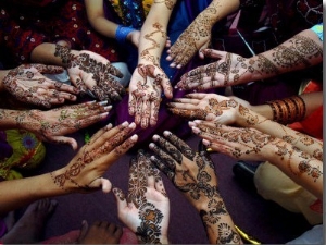Pakistani Girls Show Their Hands Painted with Henna Ahead of the Muslim Festival of Eid Al Fitr
