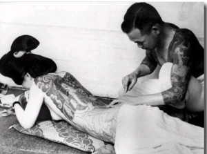 An Unidentified Japanese Tattoo Artist Works on a Woman