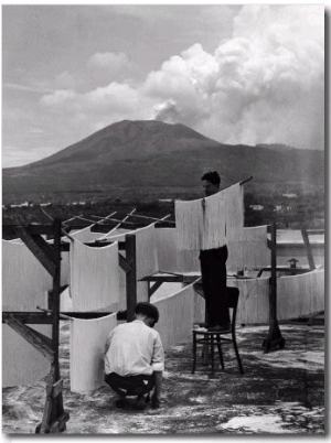 View of Mount Vesuvius from the Town of Torre Annunciata with Men Tending to Drying Pasta