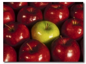 Green Apple Among Red Apples