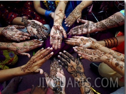 Pakistani Girls Show Their Hands Painted with Henna Ahead of the Muslim Festival of Eid Al Fitr