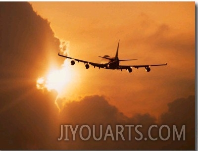 Jumbo Jet Banking Into Sunset