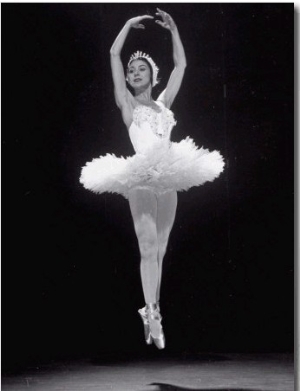 Ballerina Margot Fonteyn in White Costume Leaping into the Air While Dancing Alone on Stage