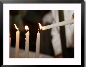 Boy lighting candles at Bar Mitzvah