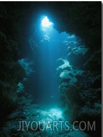 A Beam of Sunlight Illuminates an Underwater Cave