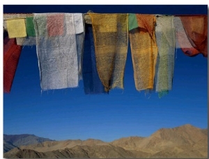 A Line of Multi Colored Prayer Flags Sway in the Gentle Breeze in Ladakh