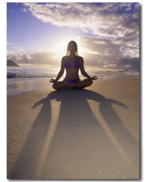 Woman Meditating on Beach