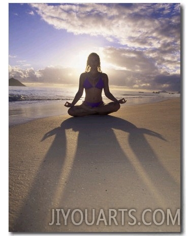 Woman Meditating on Beach