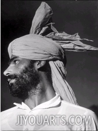 Close Up of a Young Sikh Man Sporting a Militant Looking Turban