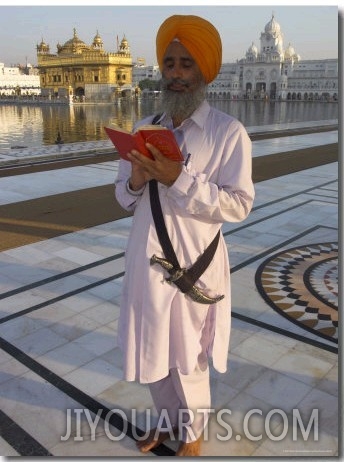 Sikh Pilgrim with Orange Turban, White Dress and Dagger, Reading Prayer Book, Amritsar
