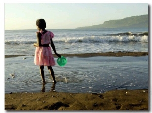 A Girl Walks on the Beach in Jacmel, Haiti, in This February 5, 2001