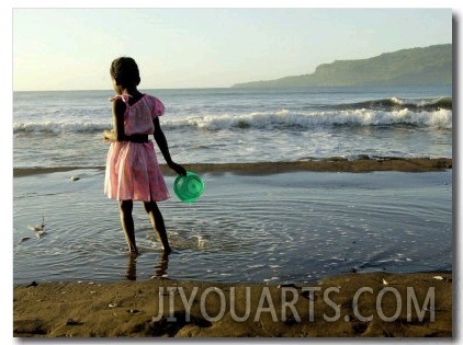 A Girl Walks on the Beach in Jacmel, Haiti, in This February 5, 2001