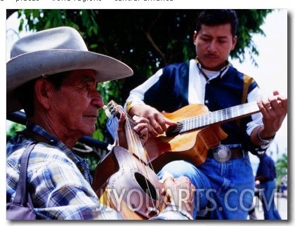 Men Strumming Guitars in Parque Libertad, San Salvador, El Salvador