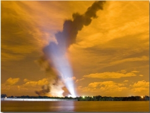 Space Shuttle Blasting Off Lights Up the Night Sky a Bright Orange