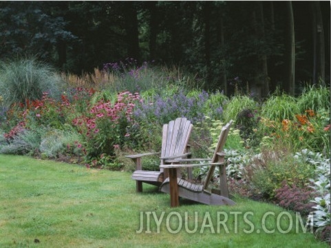 Sweeping Border Beside Wooden Adirondack Chairs with Echinacea, Nepeta and Grasses