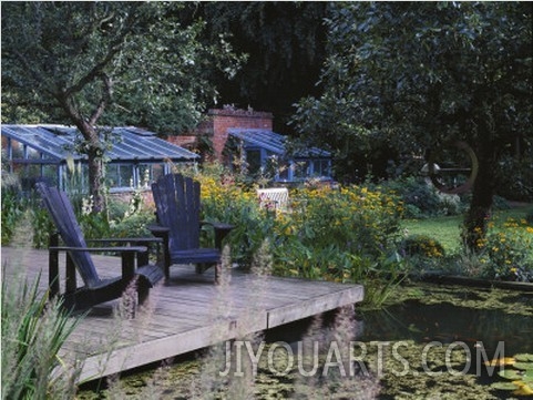View over Lily Pool to Wooden Deck with Adirondack Chairs, Designer Duncan Heather