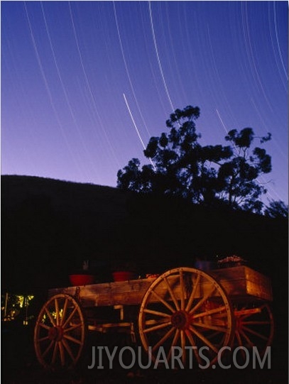 Time Exposure of a Wagon and Startrails in the Sky