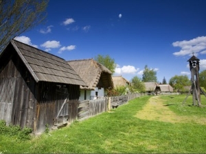 Traditional Wooden Crop Holder and Houses of Hungarian Farmers