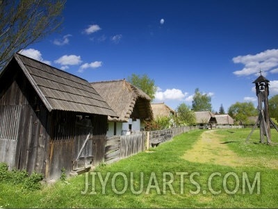 Traditional Wooden Crop Holder and Houses of Hungarian Farmers