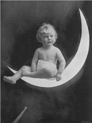 Montage of Infant in Diaper Sitting on Crescent Moon Against Background of Night Sky