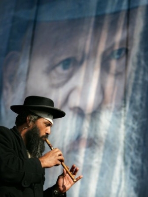 An Ultra Orthodox Jewish Man Plays a Flute